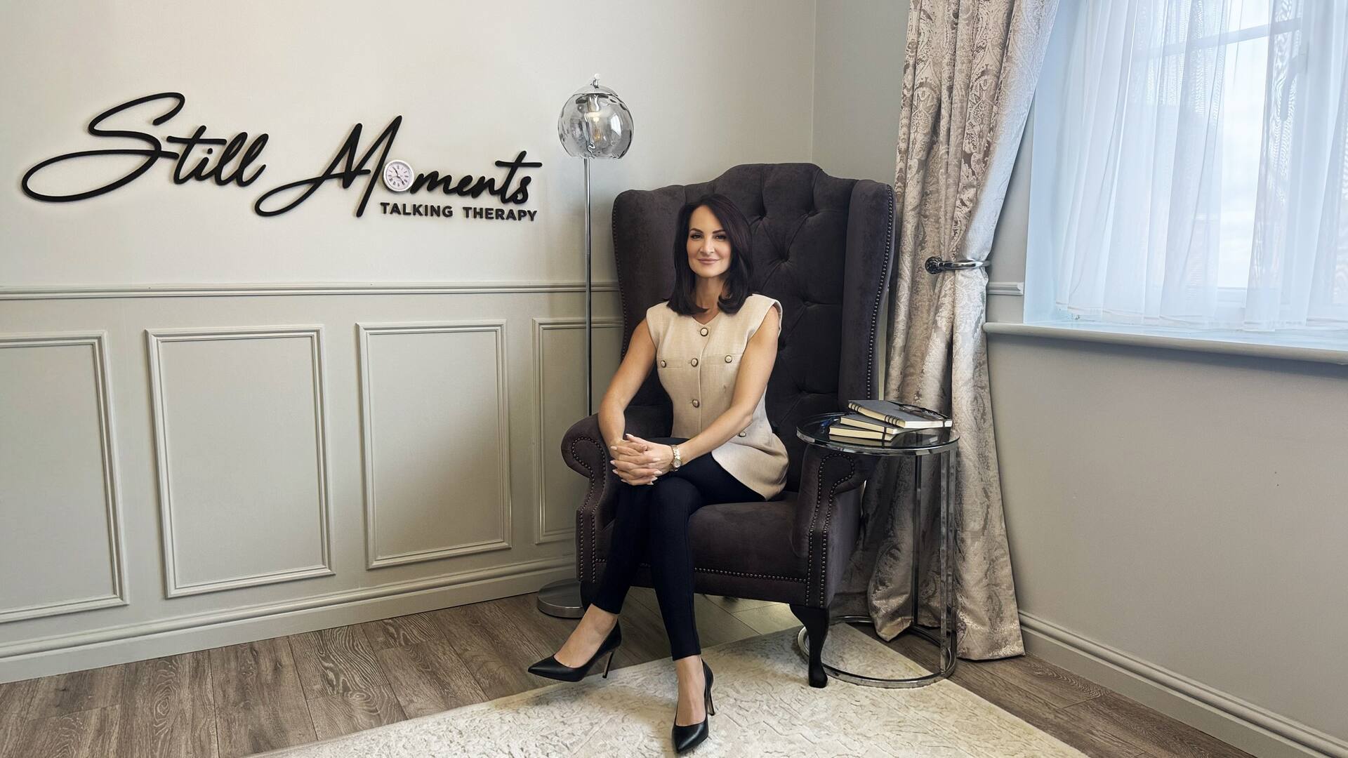 Still Moments therapy room with therapist seated in a chair