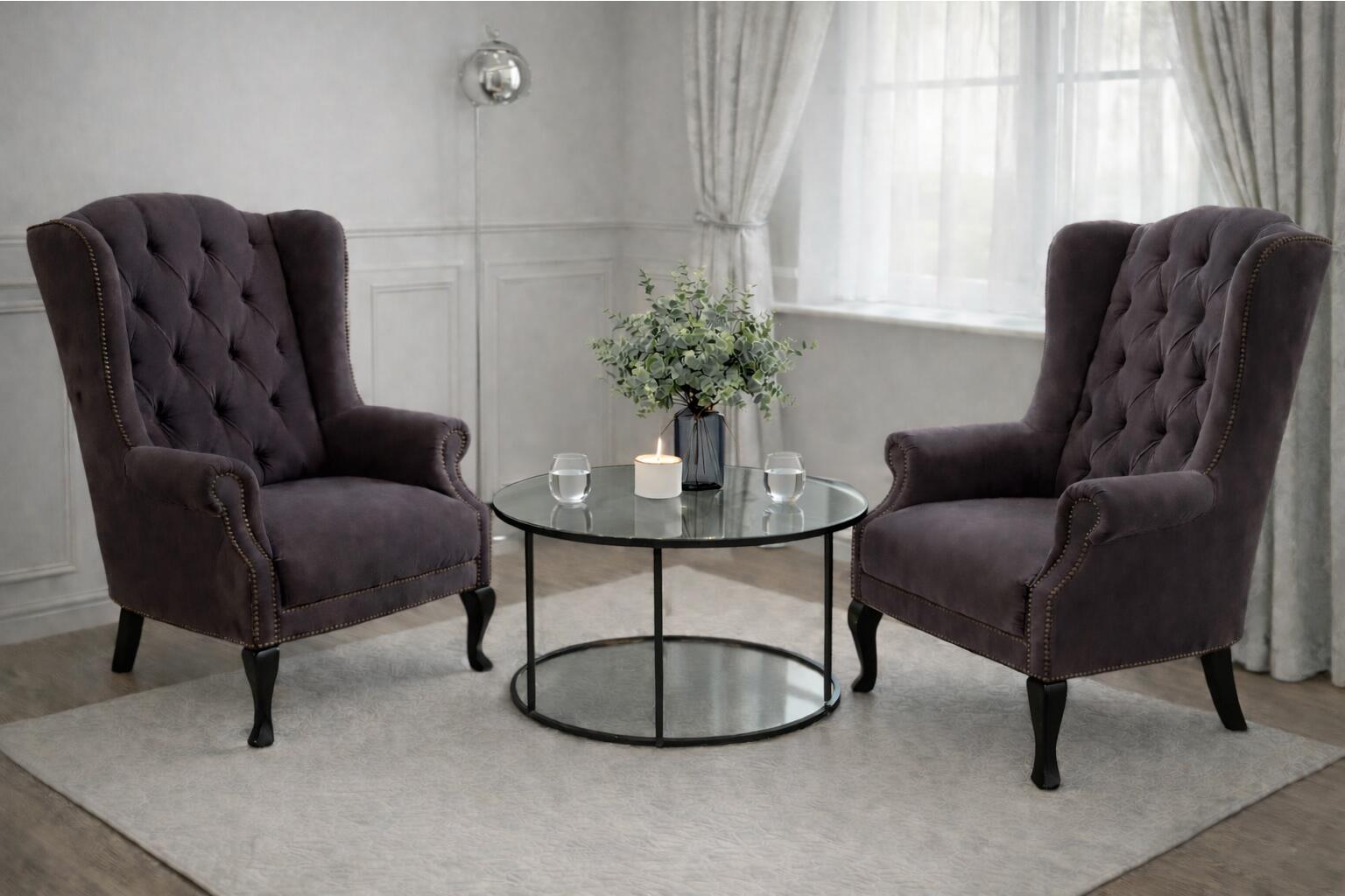 Two therapy chairs with a table in between